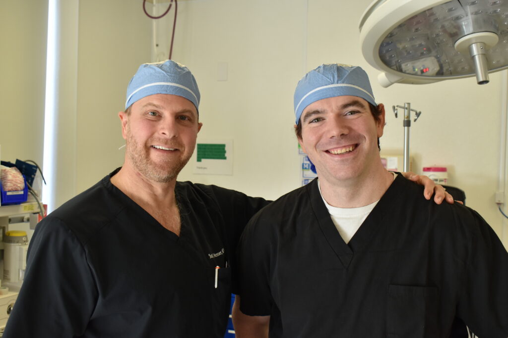 Dr. Scott Mosser and Dr. Lee Weber in the operating room